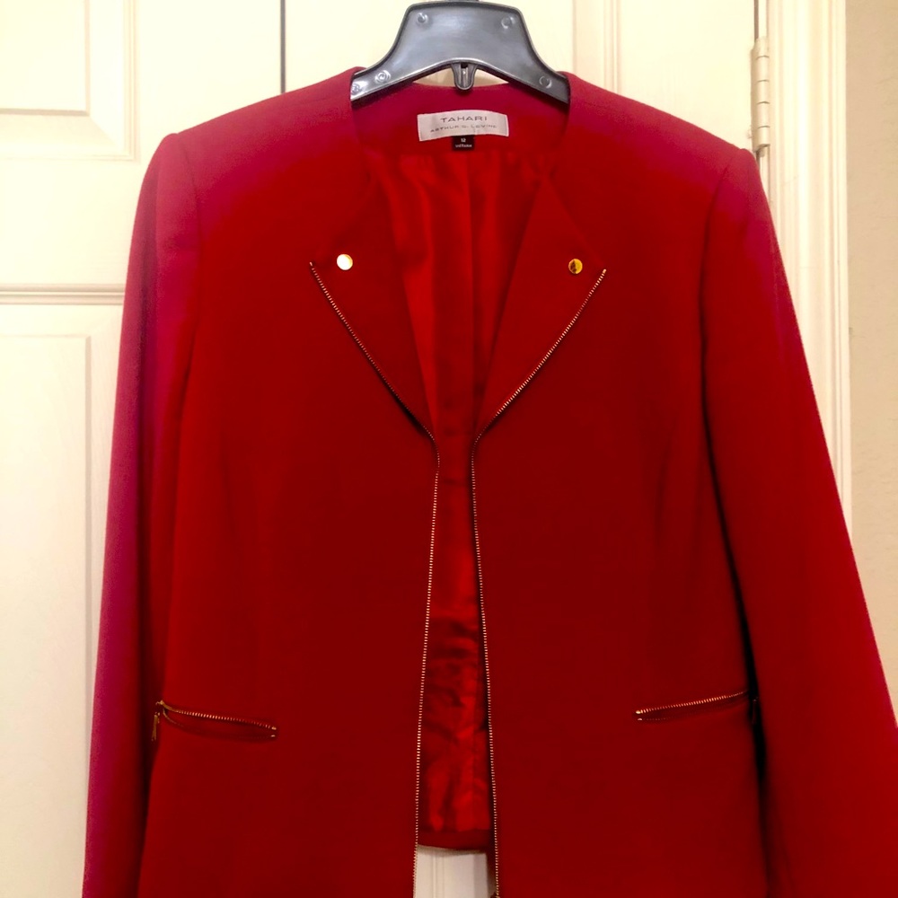 Red blazer with gold zipper accents.